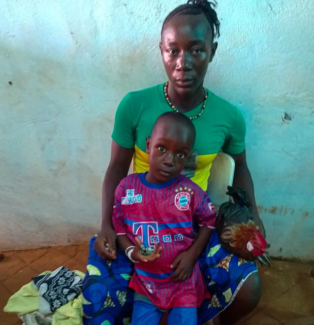 Shieku Sesay with his mother. He is included in the first group of five children to be treated as part of Africa Surgery's resumed hernia program.